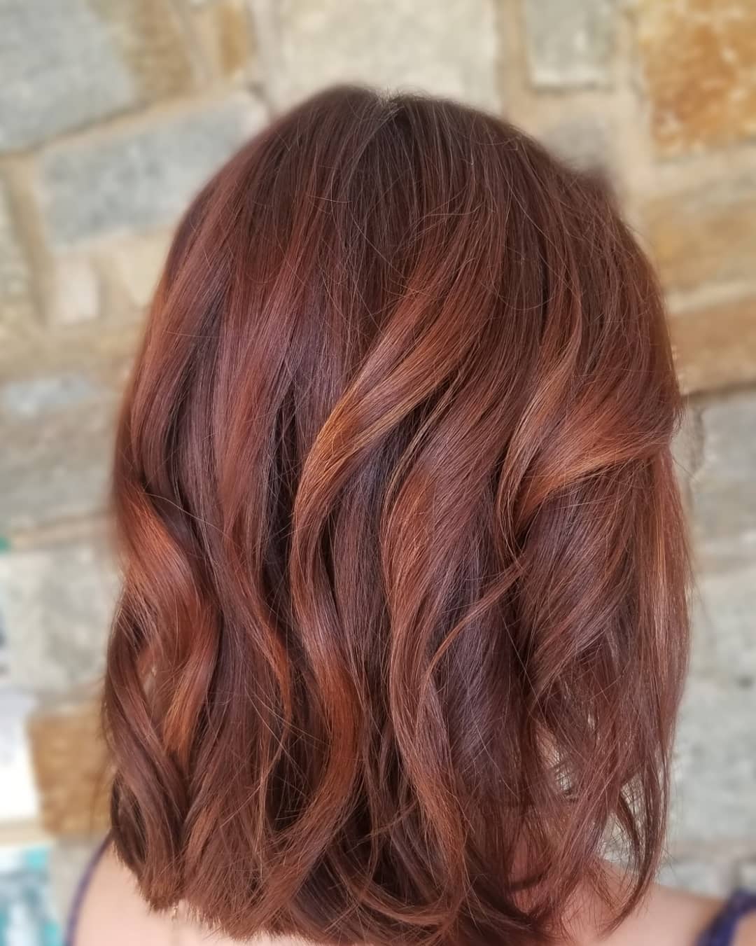 chestnut brown hair with red highlights