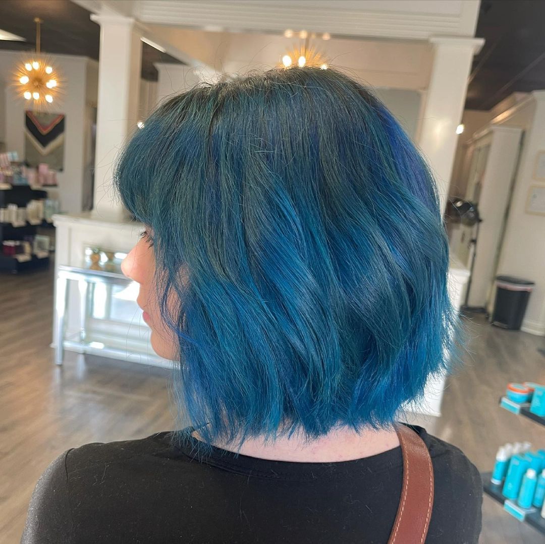 Ocean blue highlights on black hair